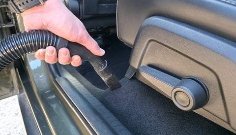 Professional vacuuming and cleaning car interior carpet detail