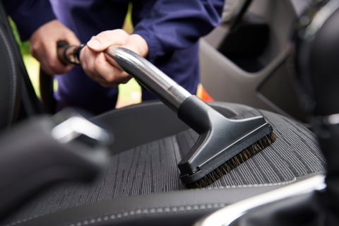 Professional vacuum extraction cleaning car seats and carpets for deep dirt removal